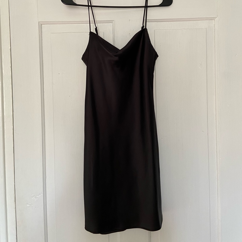 black slip dress with a scoop neck